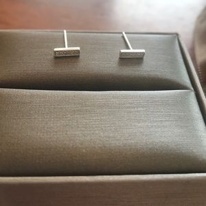 White 14 k gold bar diamond earrings.